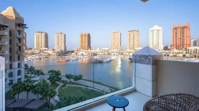 Balcony seating facing tall buildings and water