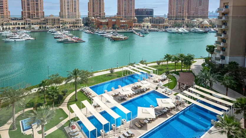 Luxury pool and yachts in view