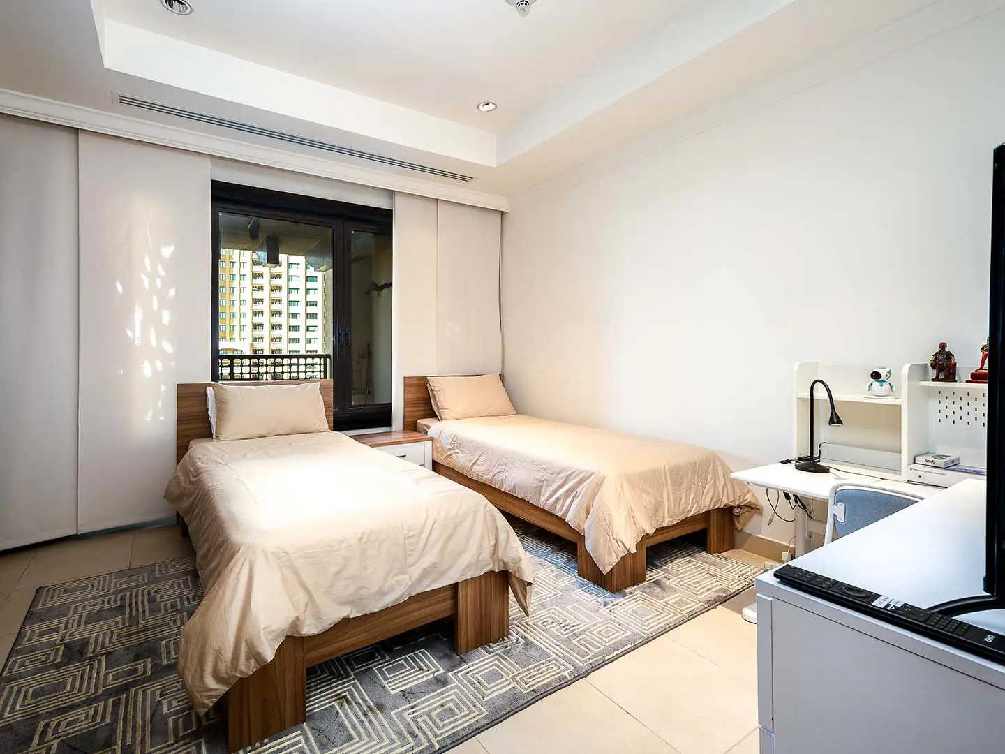 Modern room with beds and study desk